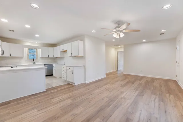 a view of kitchen with wooden floor and window