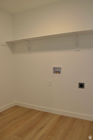 2613 Scarlet Road, Unit 258 Eagle Mountain, UT 84005 - Photo 28 of 32 Utility room featuring wood-finish flooring, white walls, and a white storage shelf