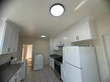 a view of an empty room and wooden floor