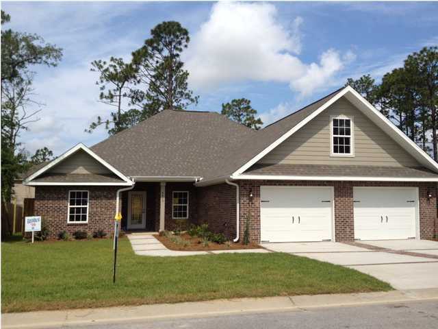 4619 Hermosa Road Crestview, FL 32539 - Photo 1 of 25 a front view of a house with a yard