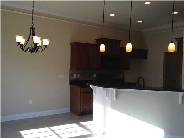 4619 Hermosa Road Crestview, FL 32539 - Photo 12 of 25 a kitchen with a sink and chandelier