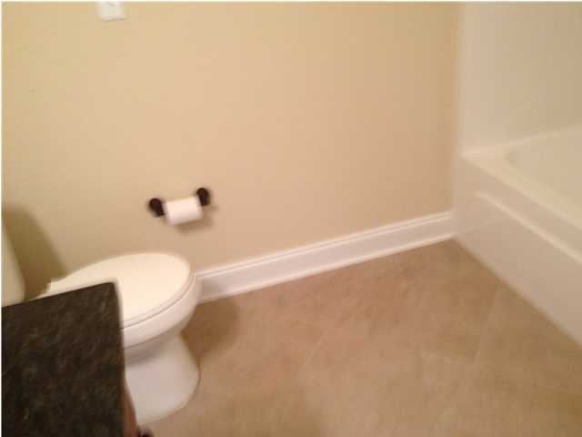 4619 Hermosa Road Crestview, FL 32539 - Photo 6 of 25 a white toilet sitting next to a white sink