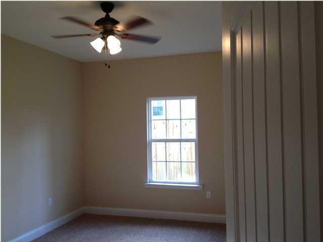4619 Hermosa Road Crestview, FL 32539 - Photo 7 of 25 an empty room with windows and fan