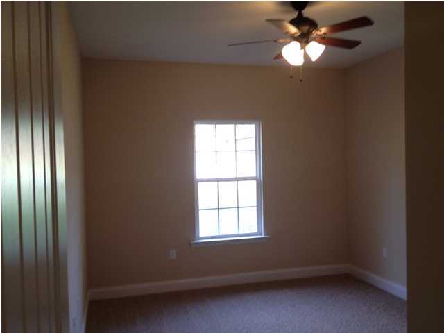 4619 Hermosa Road Crestview, FL 32539 - Photo 10 of 25 an empty room with windows and fan