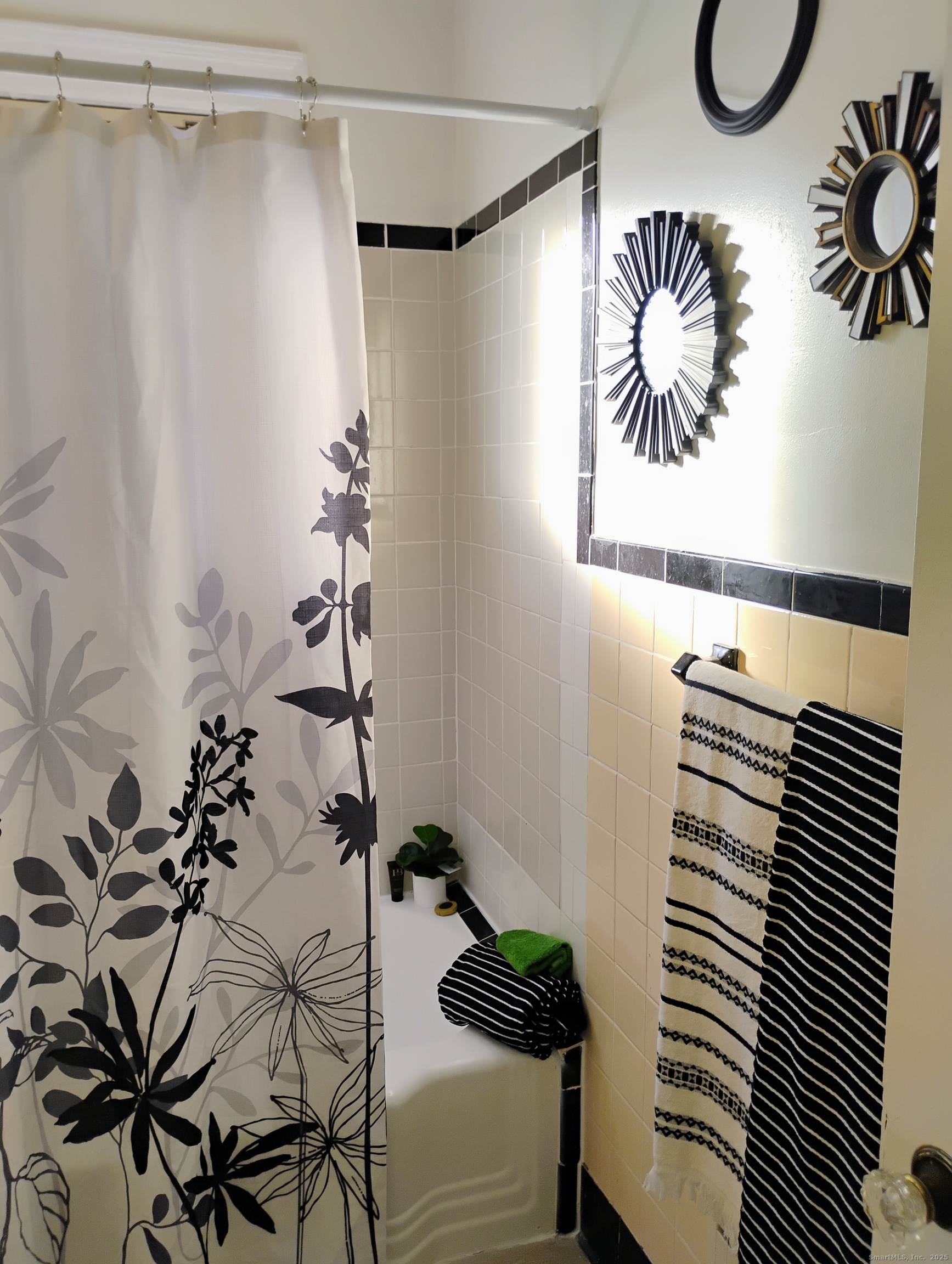 83 Colebrook Street Hartford, CT 06112 - Photo 16 of 36 a bathroom with a sink and a shower curtain