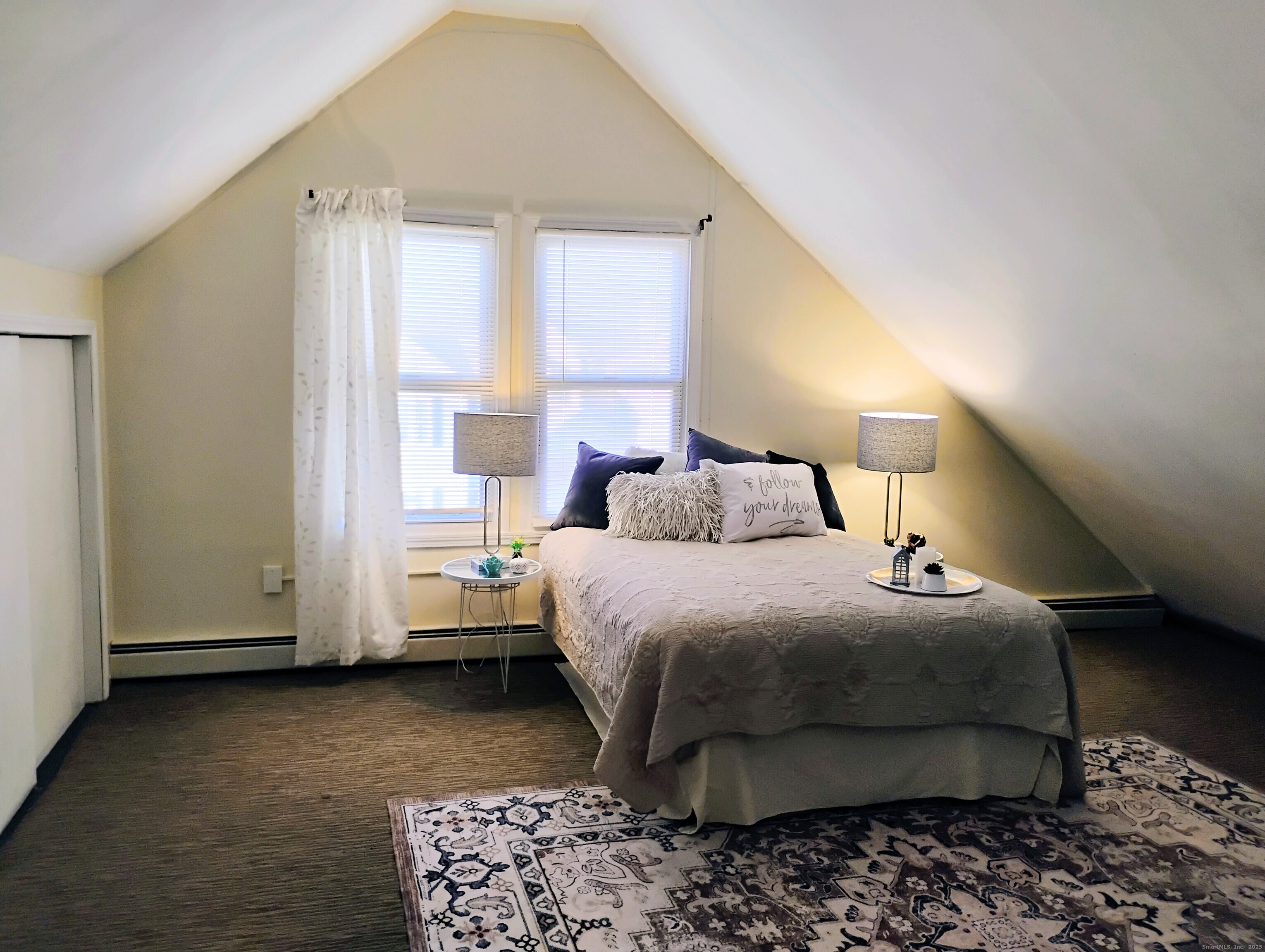 83 Colebrook Street Hartford, CT 06112 - Photo 19 of 36 a bedroom with a bed and a window