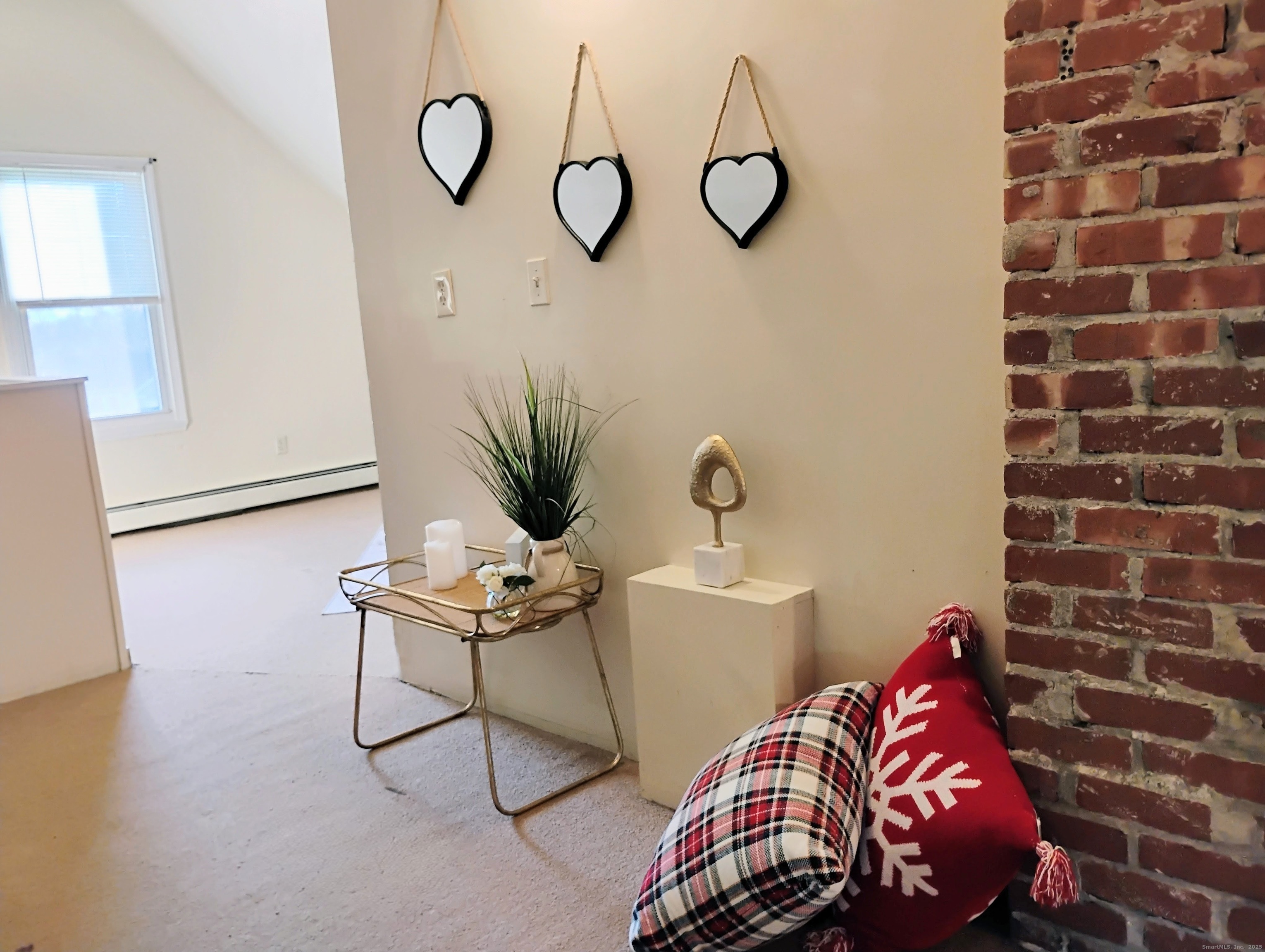 83 Colebrook Street Hartford, CT 06112 - Photo 24 of 36 a bedroom with a bed and a chandelier