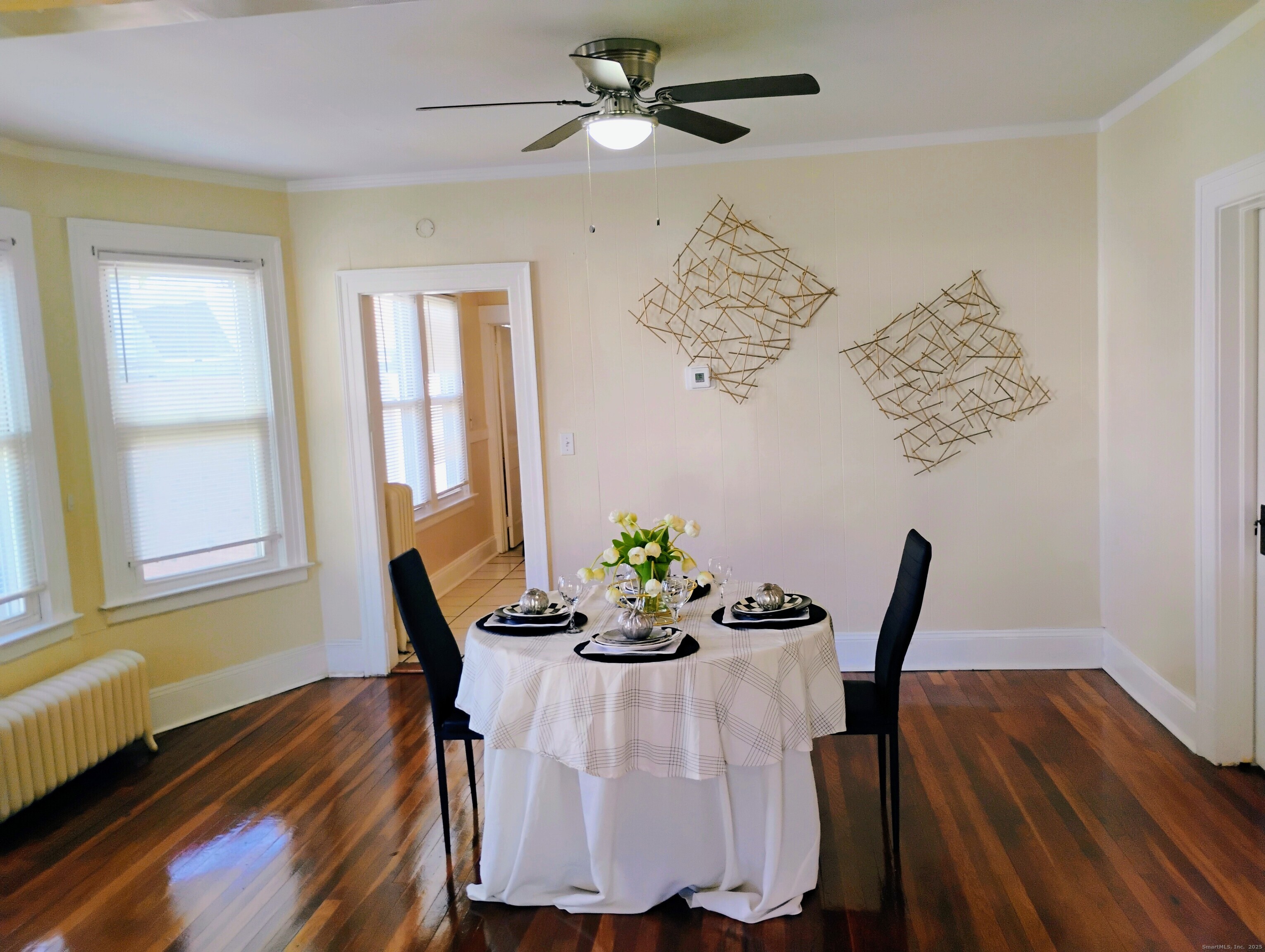 83 Colebrook Street Hartford, CT 06112 - Photo 5 of 36 a dining room with furniture a chandelier and wooden floor