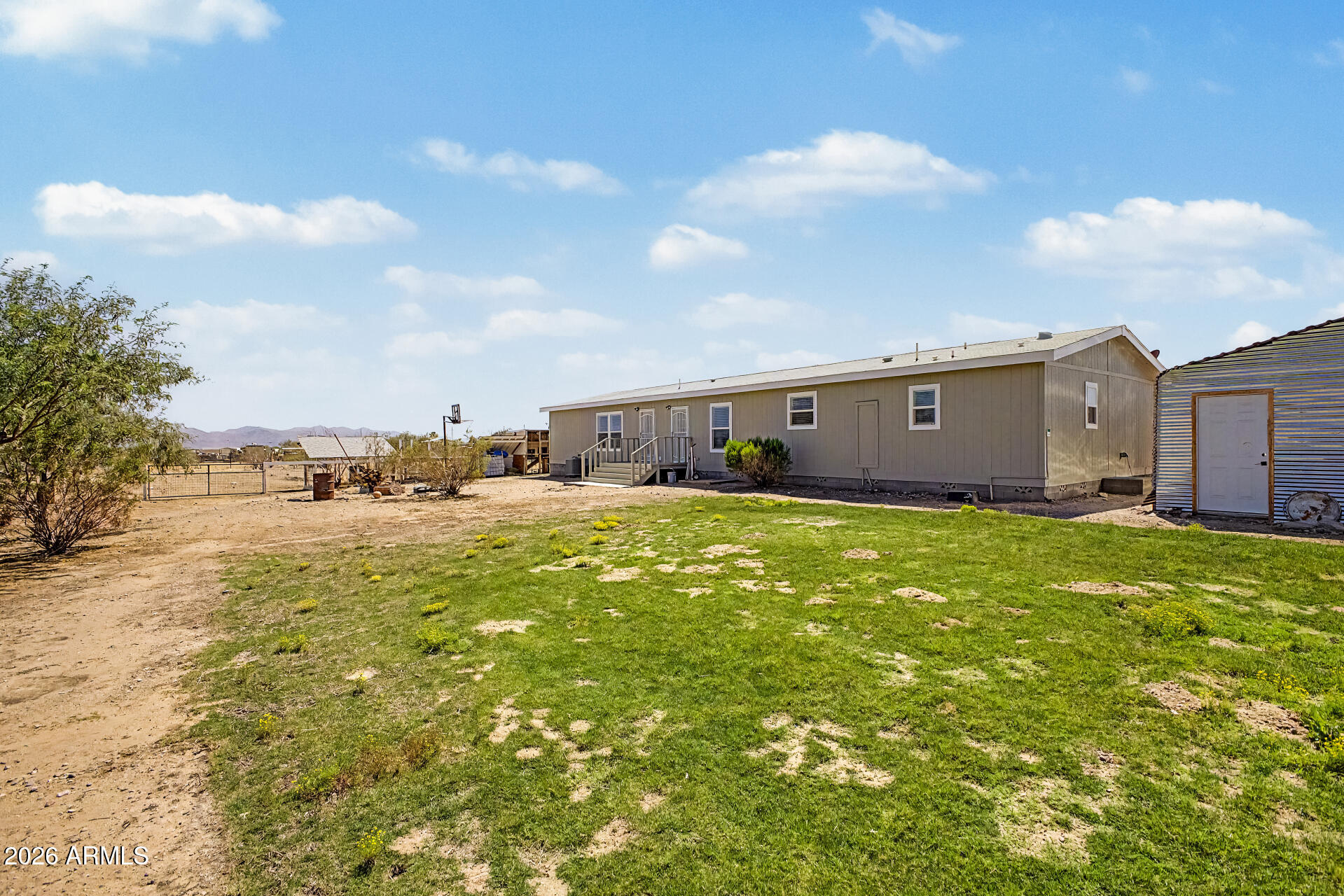 22417 West Dove Valley Road Wittmann, AZ 85361 - Photo 33 of 53 a view of a house with a yard