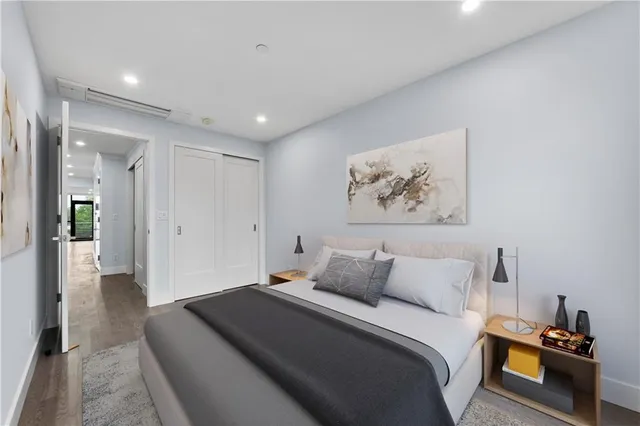 a bedroom with a bed and a view of bathroom