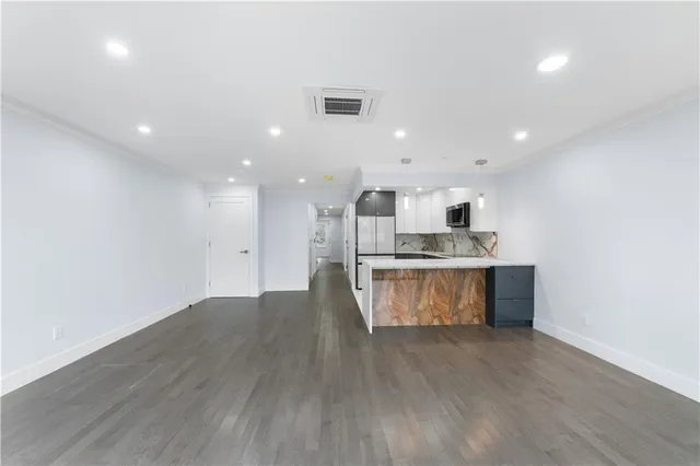 a view of kitchen with wooden floor
