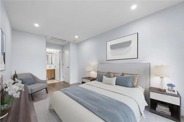 a bedroom with a bed and a couch