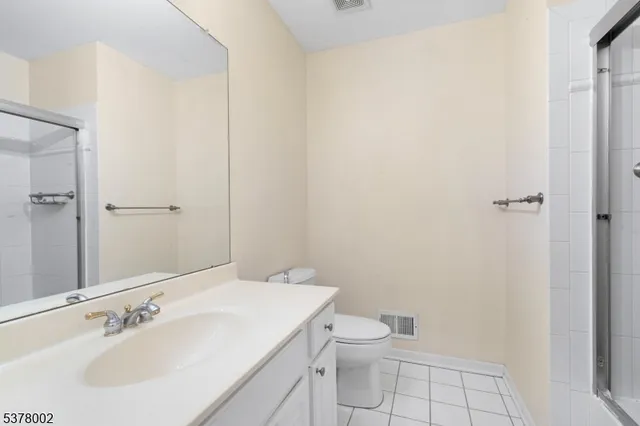 a bathroom with a sink toilet and vanity