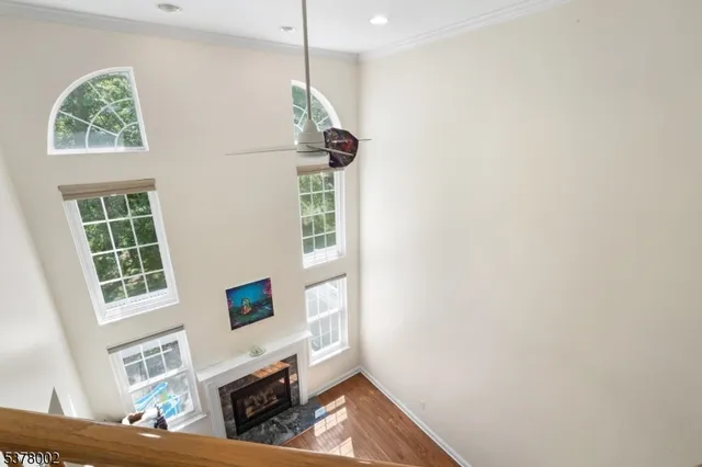 a living room with furniture a fireplace and a window