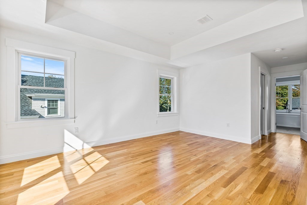 40 Foley Beach Road Hingham, MA 02043 - Photo 15 of 37 a view of empty room with wooden floor and fan