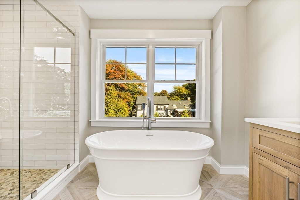 40 Foley Beach Road Hingham, MA 02043 - Photo 18 of 37 a bathroom with a bathtub and a shower