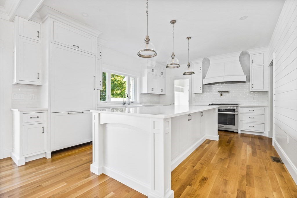 40 Foley Beach Road Hingham, MA 02043 - Photo 2 of 37 a large kitchen with cabinets wooden floor and stainless steel appliances
