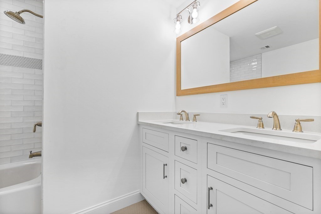 40 Foley Beach Road Hingham, MA 02043 - Photo 23 of 37 a bathroom with a sink and a mirror
