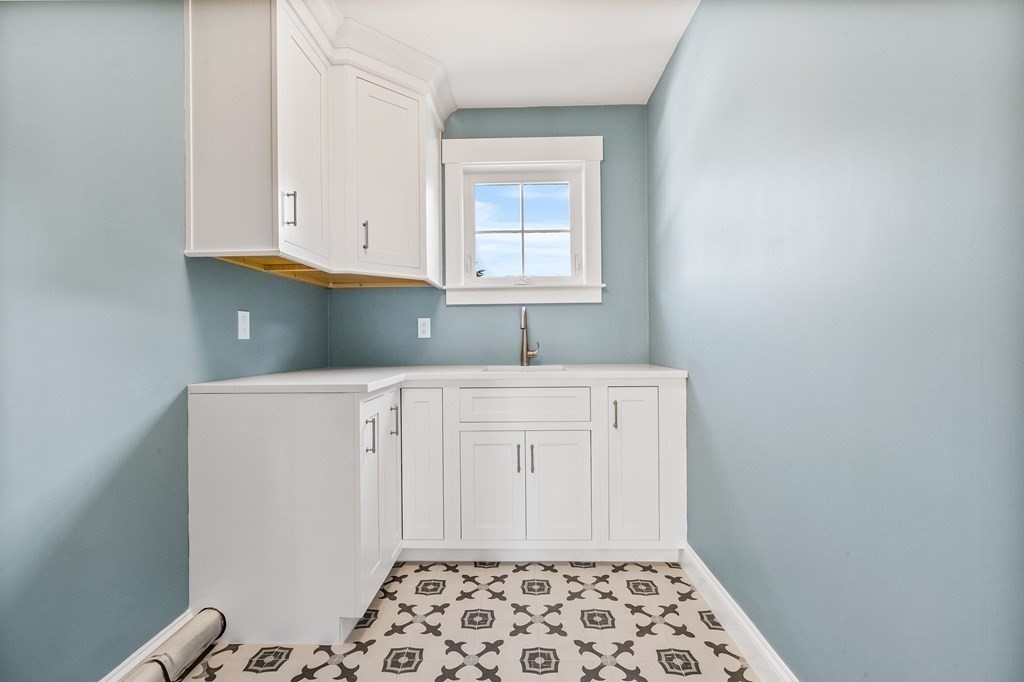 40 Foley Beach Road Hingham, MA 02043 - Photo 25 of 37 a bathroom with a sink a window and vanity