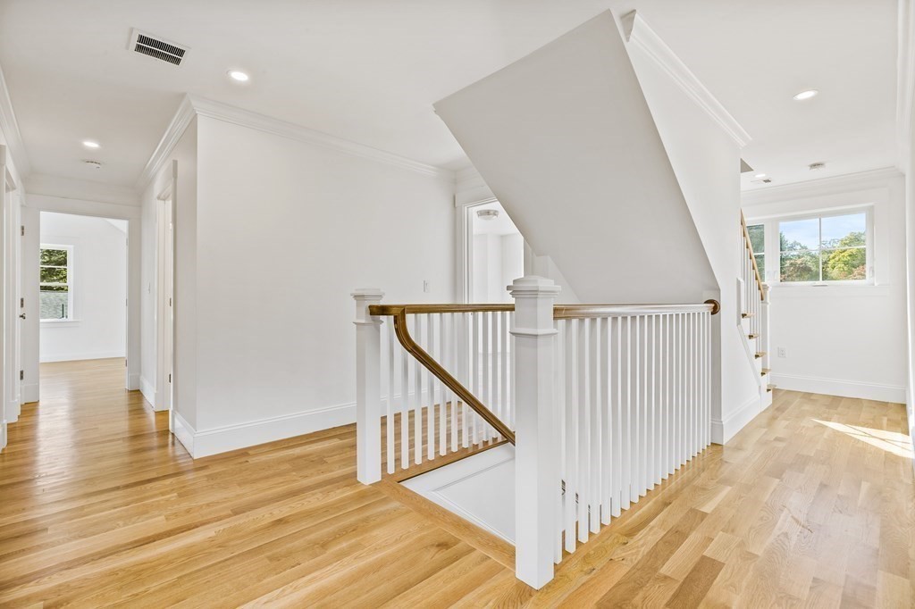 40 Foley Beach Road Hingham, MA 02043 - Photo 26 of 37 a view of a hallway with wooden floor and staircase