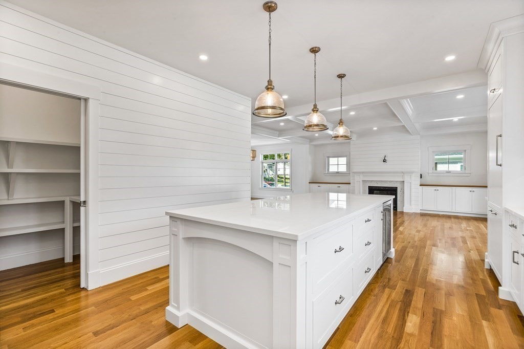 40 Foley Beach Road Hingham, MA 02043 - Photo 5 of 37 a view of a kitchen with kitchen island a sink stainless steel appliances and cabinets