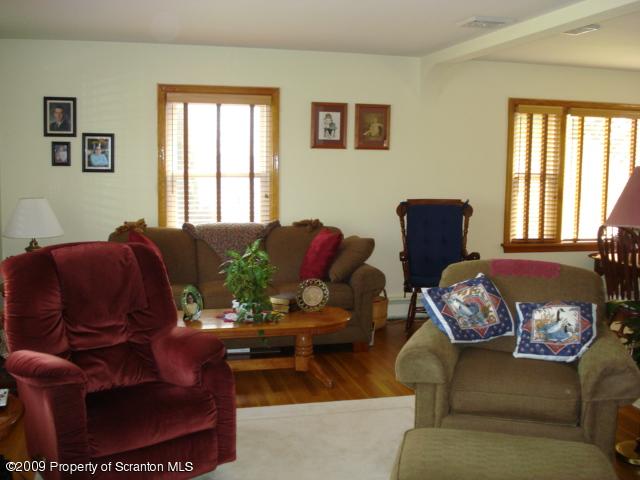 12 Grassy Pond Road Hunlock Creek, PA 18621 - Photo 2 of 9 a living room with furniture fireplace and window