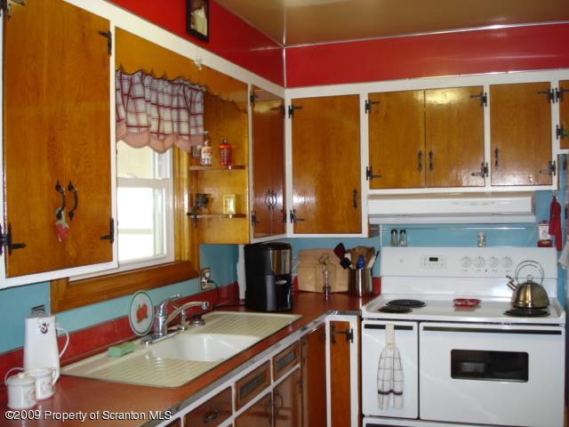 12 Grassy Pond Road Hunlock Creek, PA 18621 - Photo 4 of 9 a kitchen with a sink a stove and cabinets