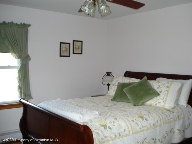 12 Grassy Pond Road Hunlock Creek, PA 18621 - Photo 5 of 9 a bedroom with a bed and a window