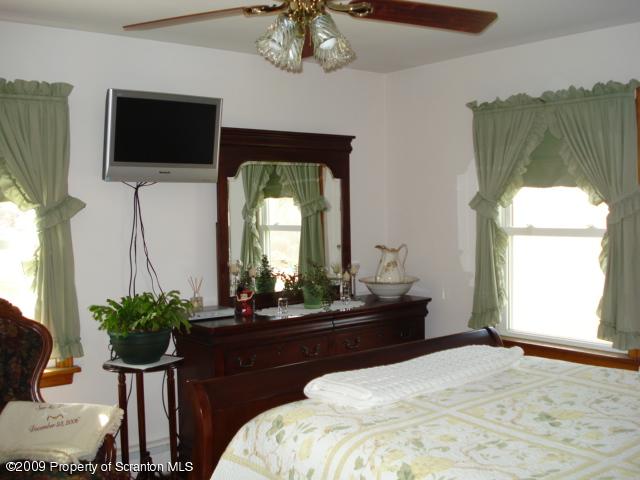 12 Grassy Pond Road Hunlock Creek, PA 18621 - Photo 6 of 9 a bedroom with a bed and a television