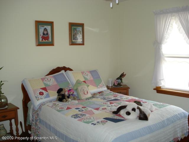 12 Grassy Pond Road Hunlock Creek, PA 18621 - Photo 7 of 9 a bedroom with a bed and a window