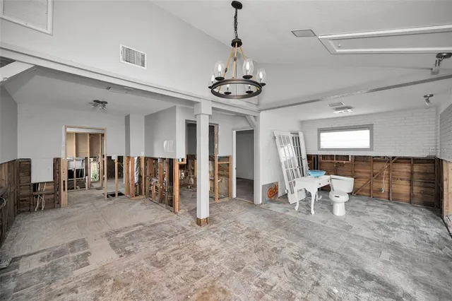 a view of a livingroom with furniture and windows
