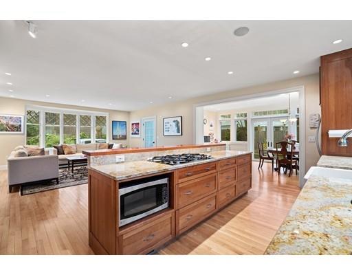 85 Griggs Road Brookline, MA 02446 - Photo 14 of 28 a kitchen with stainless steel appliances granite countertop a stove and cabinets