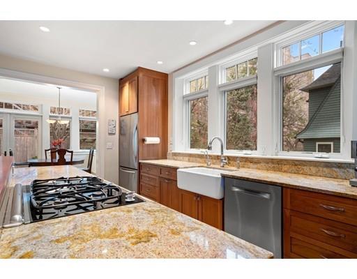 85 Griggs Road Brookline, MA 02446 - Photo 15 of 28 a kitchen with stainless steel appliances granite countertop a stove and a sink