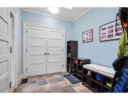 85 Griggs Road Brookline, MA 02446 - Photo 16 of 28 a living room with furniture and a table