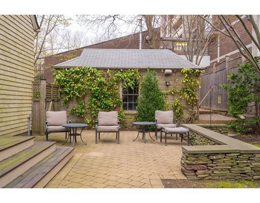 85 Griggs Road Brookline, MA 02446 - Photo 24 of 28 a view of a patio with table and chairs under an umbrella
