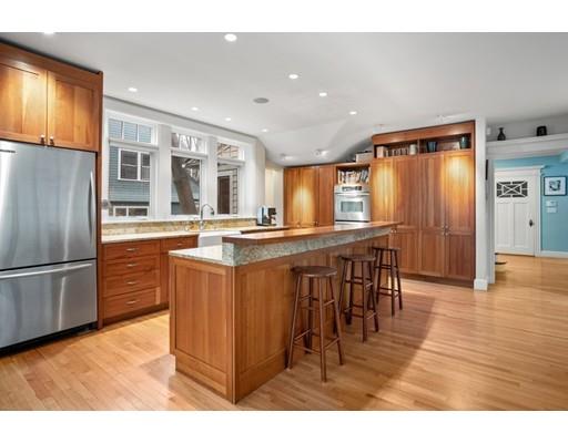 85 Griggs Road Brookline, MA 02446 - Photo 3 of 28 a kitchen with stainless steel appliances granite countertop a refrigerator and a stove top oven
