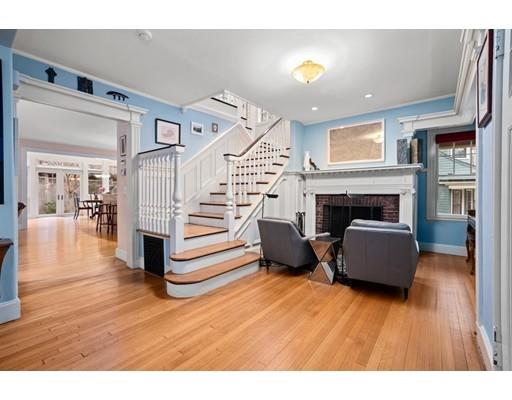 85 Griggs Road Brookline, MA 02446 - Photo 5 of 28 a living room with furniture and a fireplace
