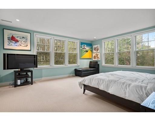 85 Griggs Road Brookline, MA 02446 - Photo 10 of 28 a spacious bedroom with a bed and a couch