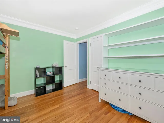 a bathroom with a sink toilet vanity and window