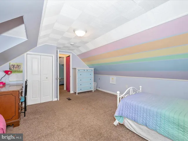 a bedroom with a bed and a cabinets