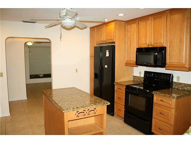 14 Knowles Road Stuart, FL 34996 - Photo 2 of 17 a kitchen with a appliances and cabinets