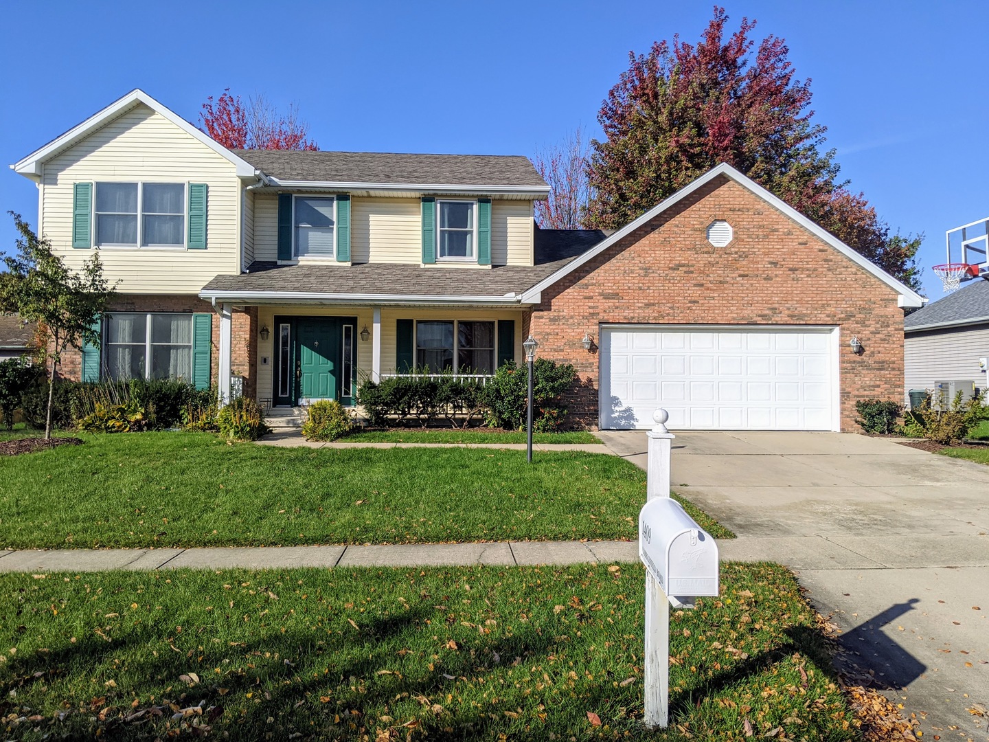 1409 Cobblefield Road Champaign, IL 61822 - Photo 1 of 73 a front view of a house with a yard and garage