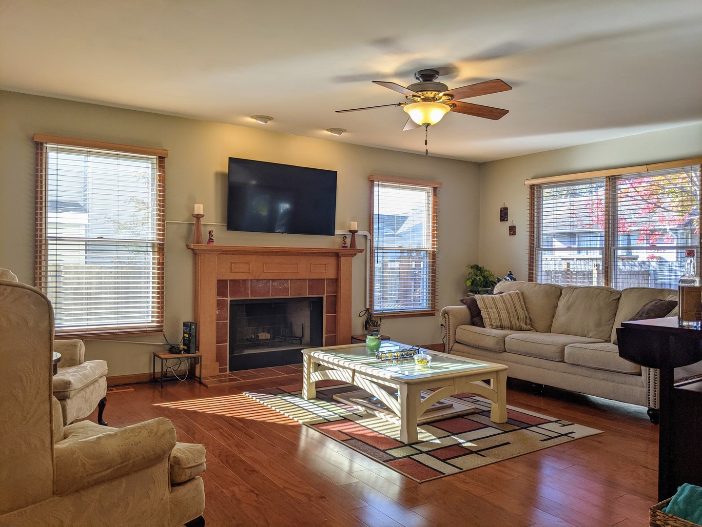 1409 Cobblefield Road Champaign, IL 61822 - Photo 11 of 73 a living room with furniture a flat screen tv and a fireplace