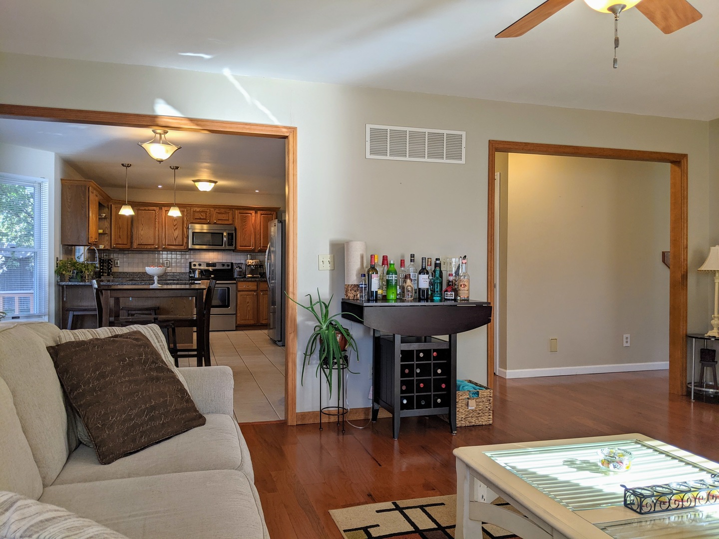 1409 Cobblefield Road Champaign, IL 61822 - Photo 14 of 73 a living room with furniture and a dining table with kitchen view