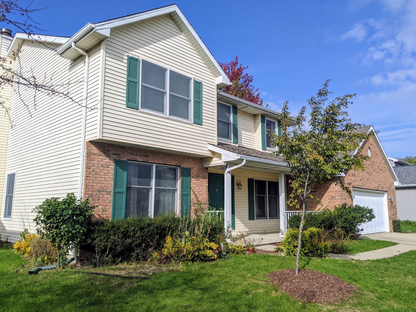 1409 Cobblefield Road Champaign, IL 61822 - Photo 70 of 73 a front view of a house with a yard and garage