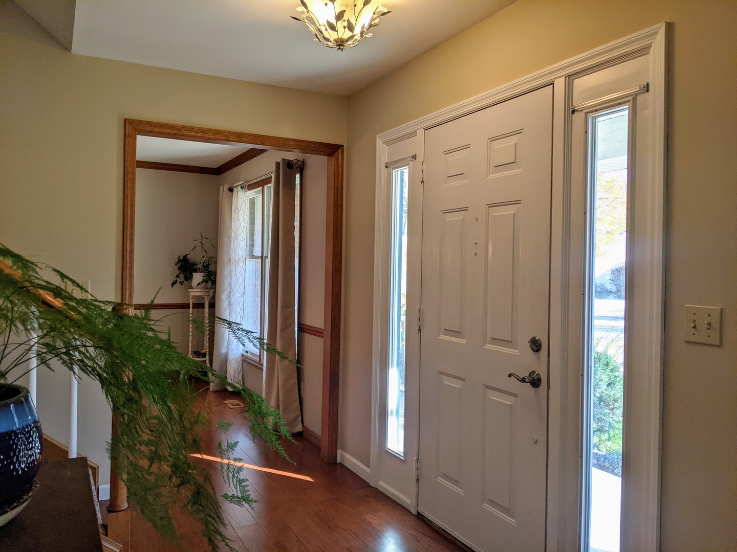 1409 Cobblefield Road Champaign, IL 61822 - Photo 8 of 73 a view of a hallway with wooden floor and stairs