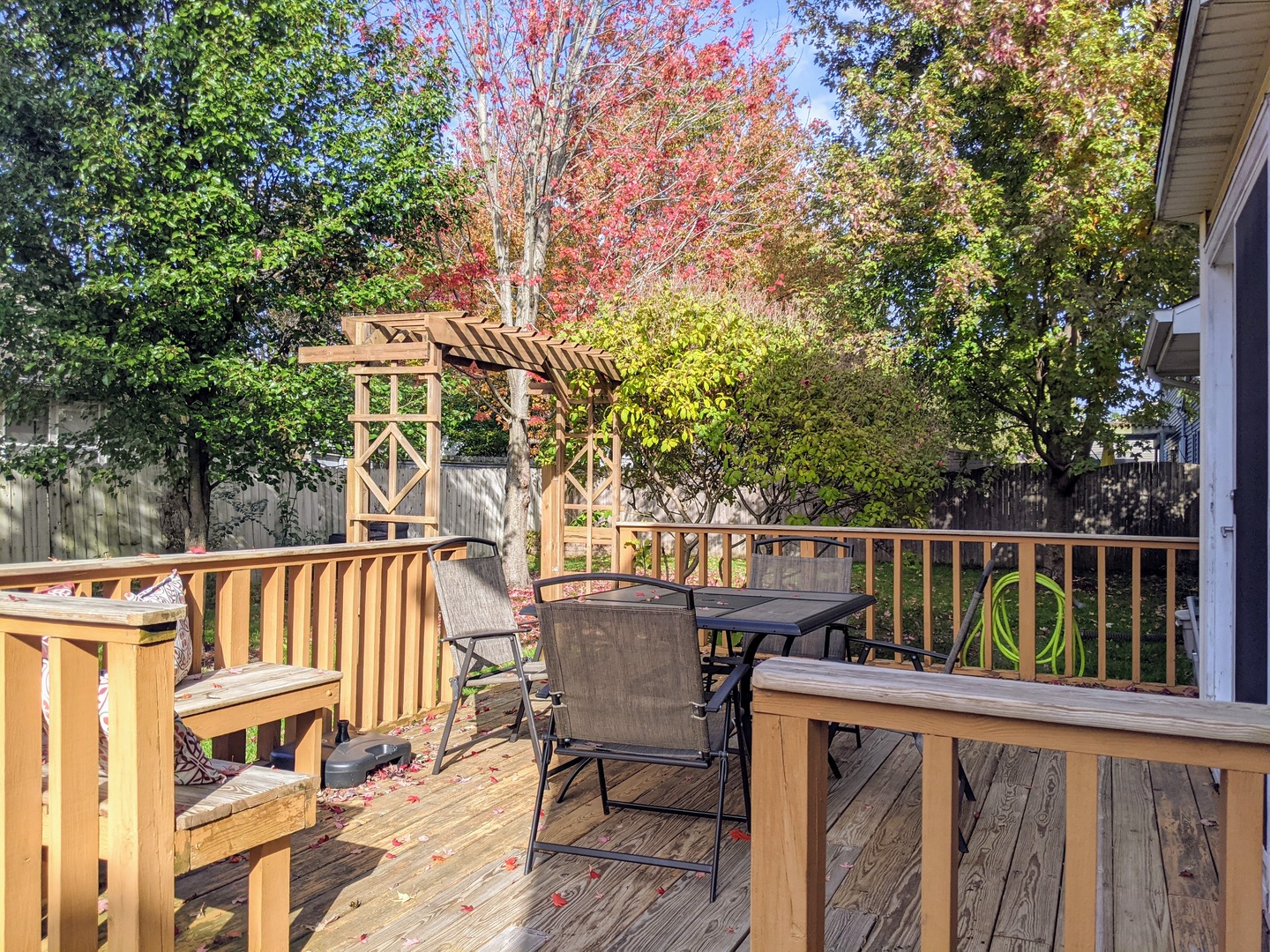1409 Cobblefield Road Champaign, IL 61822 - Photo 71 of 73 a view of a patio with table and chairs and wooden floor