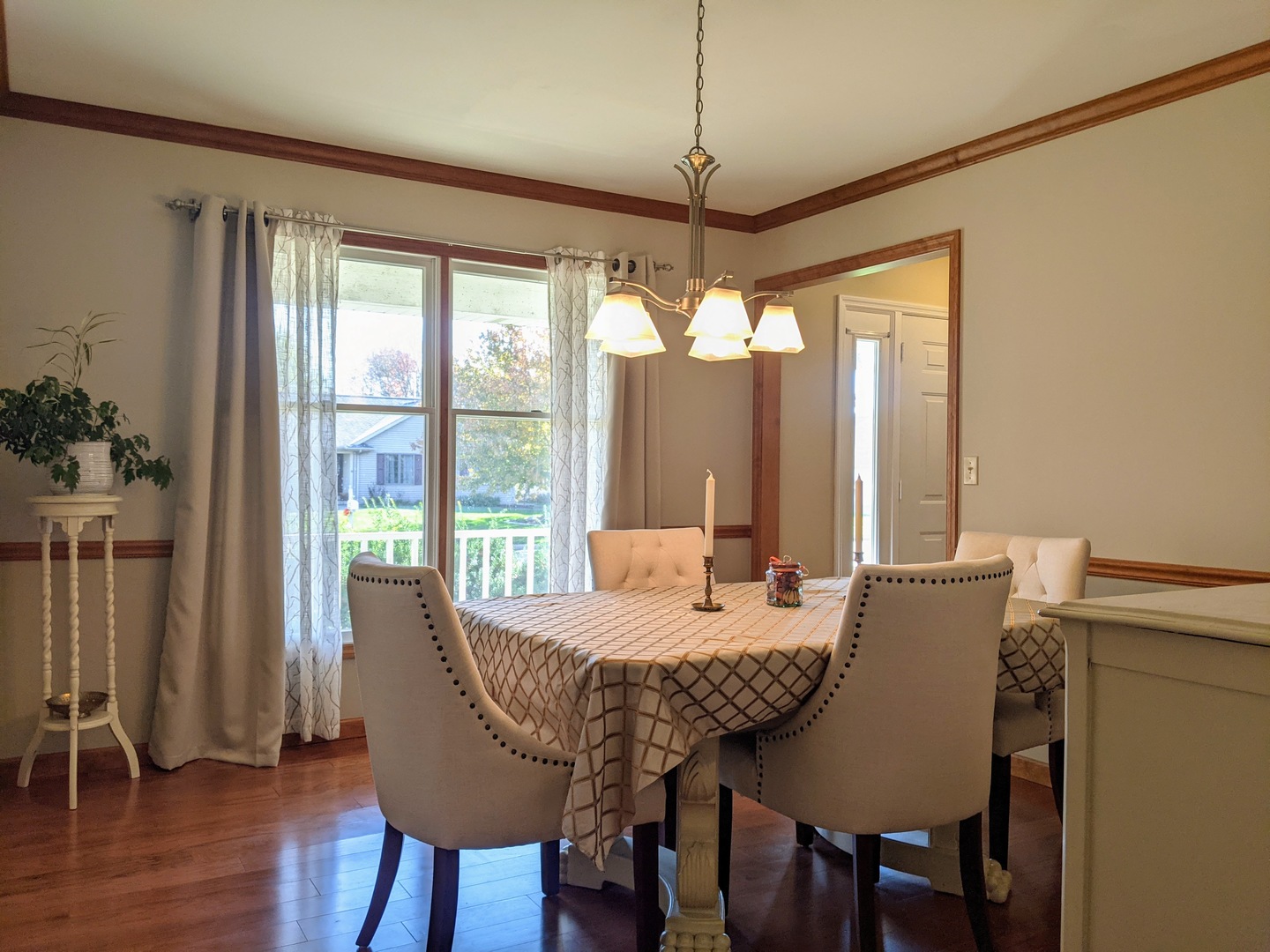 1409 Cobblefield Road Champaign, IL 61822 - Photo 10 of 73 a view of a dining room with furniture window and wooden floor