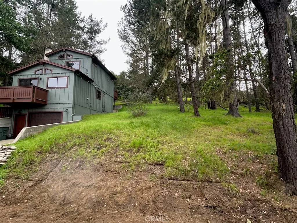 0 Emerson Road Cambria, CA 93428 - Photo 1 of 1 a front view of a house with garden