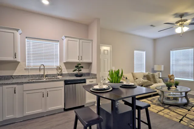 a kitchen with a table and chairs in it